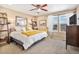 Bright bedroom featuring a large bed, ample natural light, and tasteful decor for a relaxing retreat at 1698 Odyssey Ct, Castle Rock, CO 80109