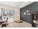 Comfortable home office with neutral wall, large window, and wall decor; cozy workspace at 1698 Odyssey Ct, Castle Rock, CO 80109