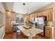 Spacious kitchen boasts a large island, stainless steel appliances, and abundant wood cabinetry at 1698 Odyssey Ct, Castle Rock, CO 80109