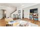 Bright living room with hardwood floors, modern furniture, and an open layout at 1698 Odyssey Ct, Castle Rock, CO 80109
