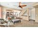 Comfortable living room showing a large window, ceiling fan, and entrance to the open floor plan at 1698 Odyssey Ct, Castle Rock, CO 80109