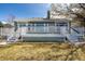 Rear exterior showcasing a spacious deck with white railings, perfect for outdoor entertaining at 5204 Shetland Ct, Highlands Ranch, CO 80130