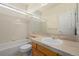 Bright bathroom with a tub, shower, vanity and tile surround at 5204 Shetland Ct, Highlands Ranch, CO 80130
