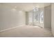 Bright primary bedroom with carpet, high ceilings and many windows at 5204 Shetland Ct, Highlands Ranch, CO 80130