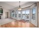 Bright living area with hardwood floors, fireplace, and sliding glass doors to a deck at 5204 Shetland Ct, Highlands Ranch, CO 80130