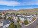 Expansive aerial view of townhomes, showcasing the community's layout and mountain views in the background at 1646 S Deframe St # B8, Lakewood, CO 80228
