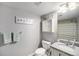 Cozy bathroom featuring modern fixtures, a granite countertop, and a mirrored medicine cabinet with a shower/tub combo at 1646 S Deframe St # B8, Lakewood, CO 80228