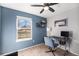 Inviting bedroom showcasing a dedicated workspace and a window offering ample natural light at 1646 S Deframe St # B8, Lakewood, CO 80228