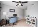 Bedroom featuring neutral walls, ceiling fan, carpeted floors and a computer desk at 1646 S Deframe St # B8, Lakewood, CO 80228