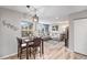 Inviting living room with large windows, comfortable seating, and stylish decor, adjacent to a dining area at 1646 S Deframe St # B8, Lakewood, CO 80228