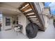 Comfortable outdoor patio with furniture, grill, and stairway at 1646 S Deframe St # B8, Lakewood, CO 80228