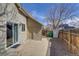Private backyard patio featuring a convenient storage shed and access to the home at 3969 S Fundy Cir, Aurora, CO 80013