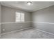 Cozy bedroom featuring neutral carpeting, paint, and a window providing ample natural light at 3969 S Fundy Cir, Aurora, CO 80013