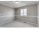 Well-lit bedroom featuring neutral carpeting, paint, and a window providing ample natural light at 3969 S Fundy Cir, Aurora, CO 80013