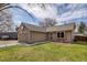 Inviting home featuring a well-maintained front yard, two-car garage and a basketball hoop at 3969 S Fundy Cir, Aurora, CO 80013