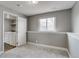 Modern laundry room with a washer and dryer included with shelving for storage at 3969 S Fundy Cir, Aurora, CO 80013