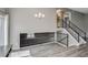 Bright and open living room featuring sleek metal railings and modern wood flooring at 3969 S Fundy Cir, Aurora, CO 80013
