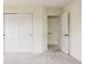 Spacious bedroom boasts pristine white doors and trim, enhancing its bright and airy feel at 8122 E 6Th Pl, Denver, CO 80230