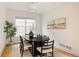 Elegant dining room with modern table, neutral color scheme, and natural light creating a perfect space for gatherings at 8122 E 6Th Pl, Denver, CO 80230