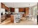 Spacious kitchen with stainless steel appliances, ample cabinetry, and large island with seating for casual dining at 8122 E 6Th Pl, Denver, CO 80230