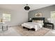 Inviting main bedroom with a king bed, stylish decor, and ample natural light at 8122 E 6Th Pl, Denver, CO 80230