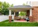Covered patio with stylish furniture and a vibrant outdoor rug, ideal for entertaining guests at 8122 E 6Th Pl, Denver, CO 80230