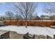 Fenced backyard with patio and small fountain at 2400 S Halifax Way, Aurora, CO 80013