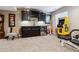 Basement bar with dark cabinetry, granite countertops, and mini-fridge at 2400 S Halifax Way, Aurora, CO 80013