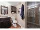 Basement bathroom with walk-in shower and granite vanity at 2400 S Halifax Way, Aurora, CO 80013