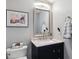 Updated bathroom features granite vanity and modern fixtures at 2400 S Halifax Way, Aurora, CO 80013