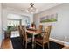 Dining room with hardwood floors, a wooden table, and a chandelier at 2400 S Halifax Way, Aurora, CO 80013