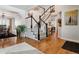 Bright entryway with hardwood floors and a staircase leading upstairs at 2400 S Halifax Way, Aurora, CO 80013