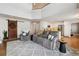 Open concept living room with high ceilings and views into kitchen at 2400 S Halifax Way, Aurora, CO 80013