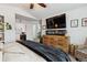 Main bedroom with a large TV, fireplace and comfortable seating area at 2400 S Halifax Way, Aurora, CO 80013