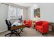 Home office with a desk, two chairs, and ample natural light at 2400 S Halifax Way, Aurora, CO 80013