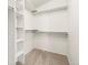 Walk in closet includes built in shelving for seamless organization at 6664 S Webster St, Littleton, CO 80123