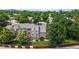 Back exterior shot surrounded by lush greenery; note the private fenced yard at 6664 S Webster St, Littleton, CO 80123