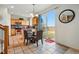 Eat-in kitchen with tile floors, stainless appliances, and a sliding door to the backyard at 5556 Lewiston Ct, Denver, CO 80239