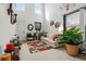 Bright living room with high ceilings, modern decor, and a cozy seating area at 5556 Lewiston Ct, Denver, CO 80239