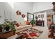 Stylish living room with a cozy sofa, fireplace, and plenty of natural light at 5556 Lewiston Ct, Denver, CO 80239