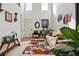 Inviting living room with high ceilings, a comfortable sofa, and a bright, airy atmosphere at 5556 Lewiston Ct, Denver, CO 80239