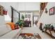 Comfortable living area with fireplace, large windows, and staircase to upper level at 5556 Lewiston Ct, Denver, CO 80239