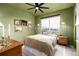 Cozy bedroom featuring a comfortable bed, neutral-toned walls, and a view from the bright window at 4925 W 10Th Ave # 111, Denver, CO 80204