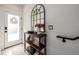 Stylish entryway featuring a console table, decorative mirror, and a staircase at 4925 W 10Th Ave # 111, Denver, CO 80204
