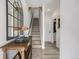 Inviting hallway with stairs, elegant decor, and access to other rooms in the home at 4925 W 10Th Ave # 111, Denver, CO 80204
