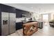 Modern kitchen with black cabinets, stainless steel appliances, and an open layout perfect for entertaining at 4925 W 10Th Ave # 111, Denver, CO 80204