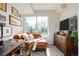 Well-lit office with a desk, chaise lounge, and decor at 4925 W 10Th Ave # 111, Denver, CO 80204