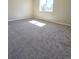 Spacious bedroom with neutral carpeting and a bright window at 3225 S Garrison St # 19, Lakewood, CO 80227