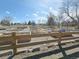 View of community garden that features multiple garden beds and a playground area at 3225 S Garrison St # 19, Lakewood, CO 80227