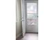 Open white door leads to outdoor space with light hardwood flooring at 3225 S Garrison St # 19, Lakewood, CO 80227